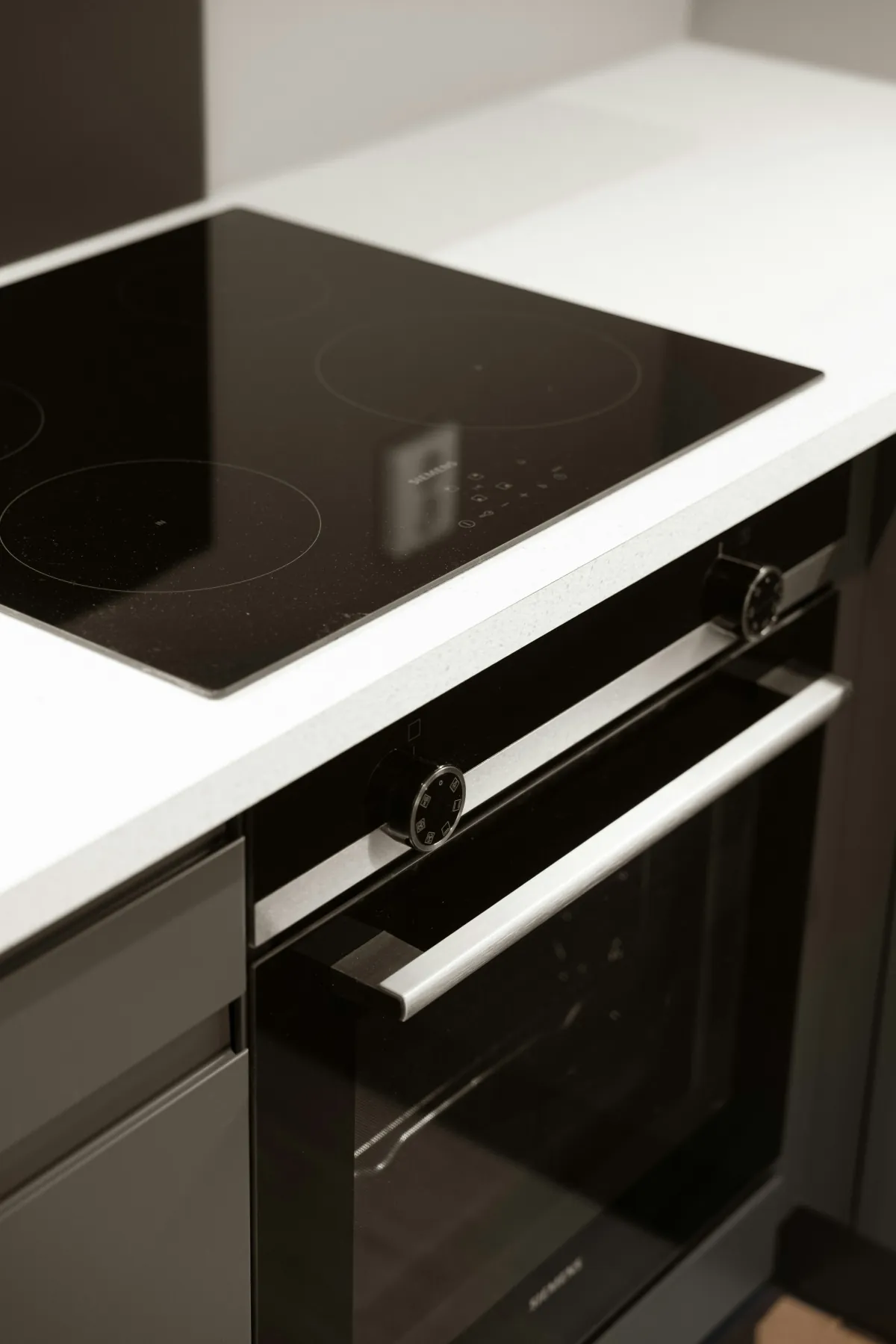 Gleaming black cooktop and built-in oven