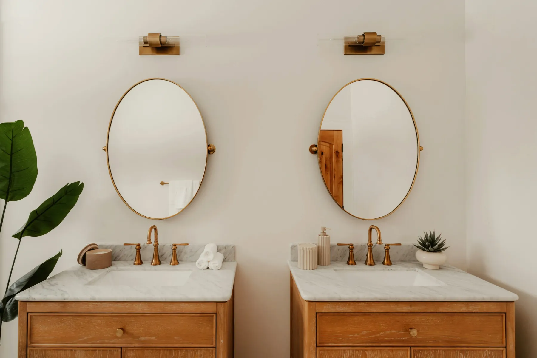 Freshly cleaned double vanity with brass fixtures